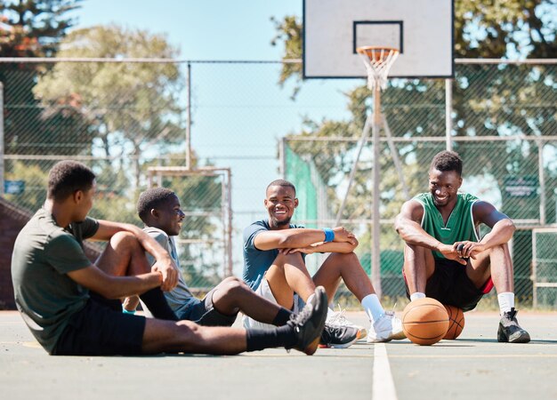 Featuring a group of friends relaxing on a basketball court